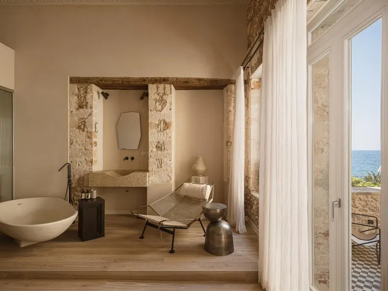 Bathroom nook with tub and ocean view