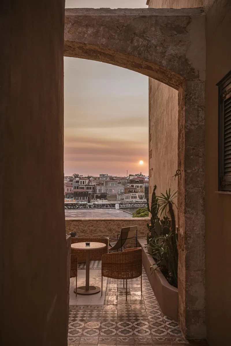 Archway view of harbor at sunset