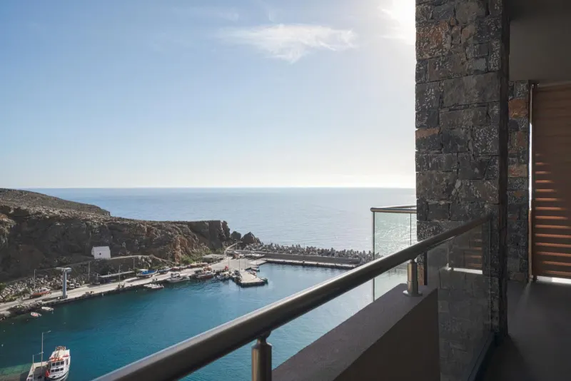Balcony view of marina and mountains