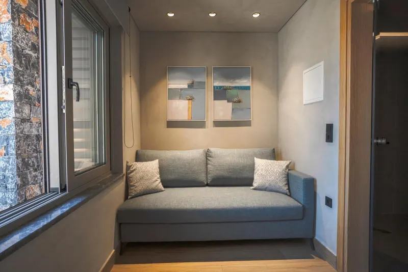 Small lounge with sofa and abstract art