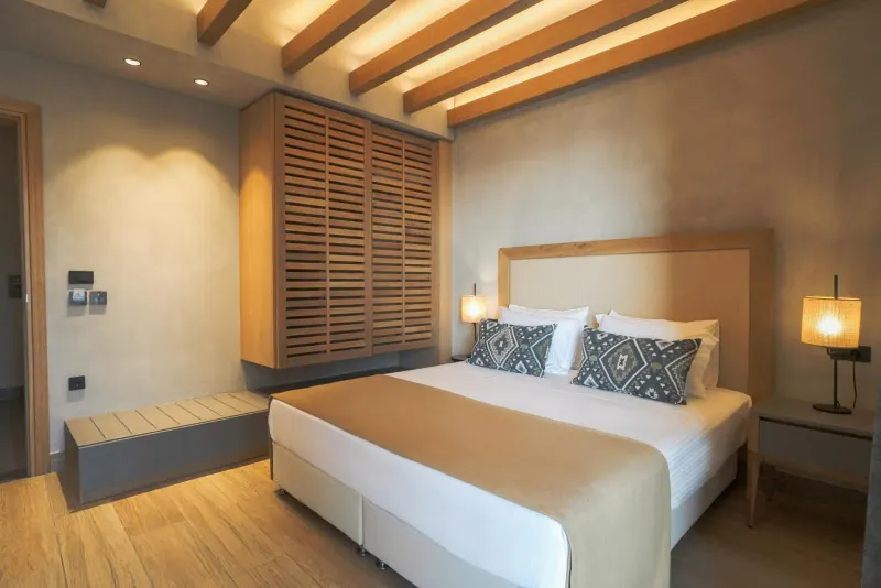 Bedroom with wooden shutters and warm lighting