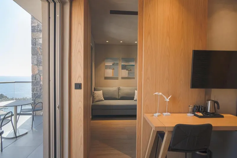 Room entrance with desk and sea view