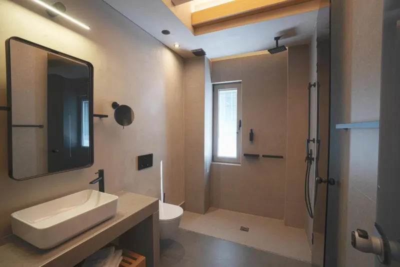 Bathroom with wooden beam ceiling and shower