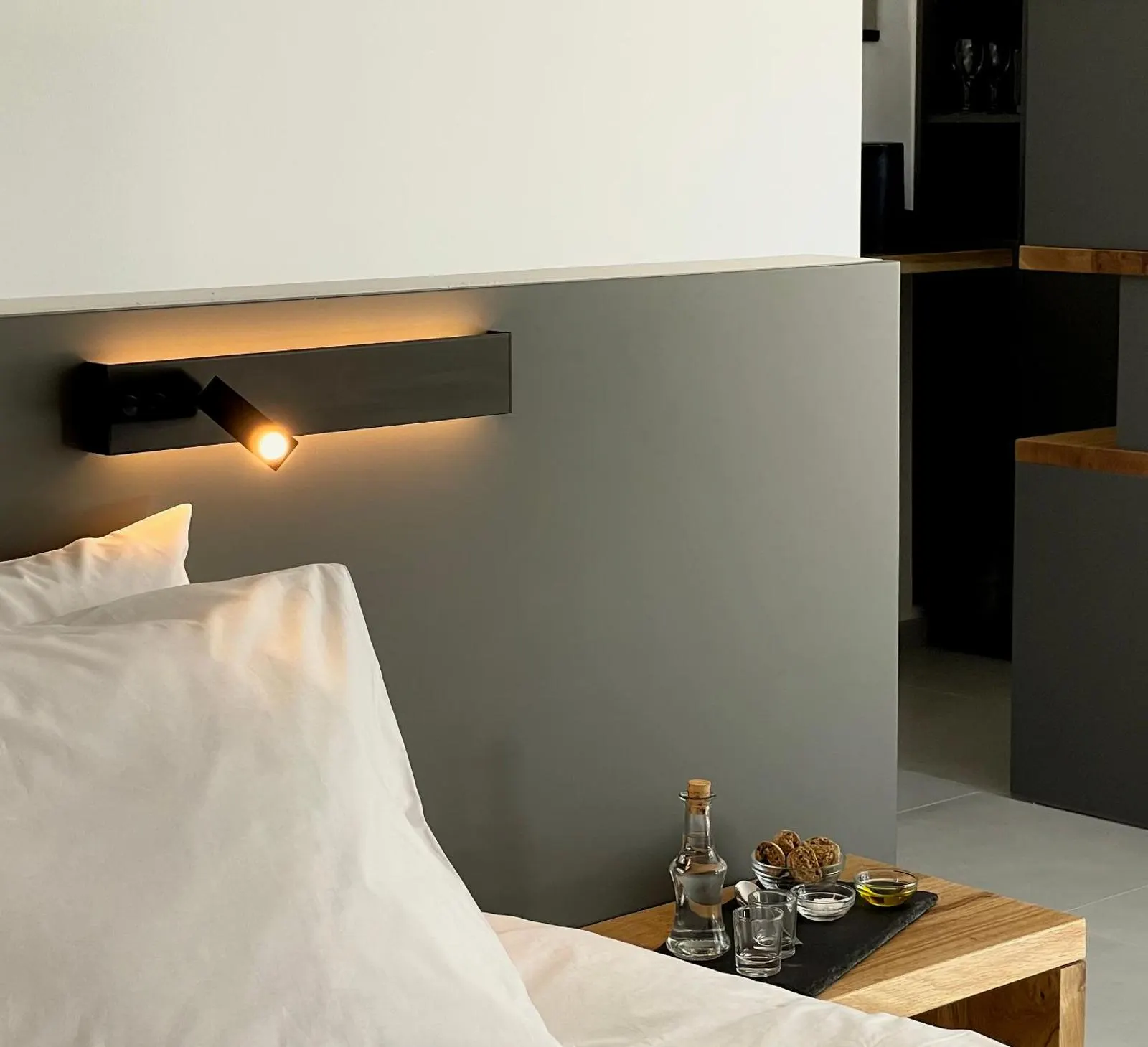 Bedside table with reading light and minibar tray