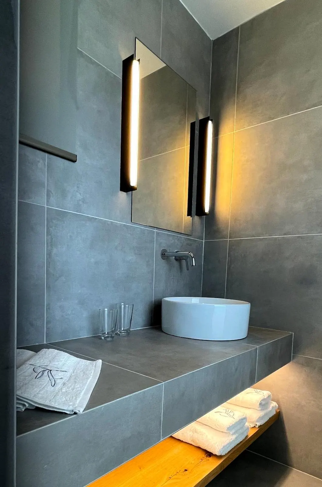 Modern grey stone bathroom with vessel sink