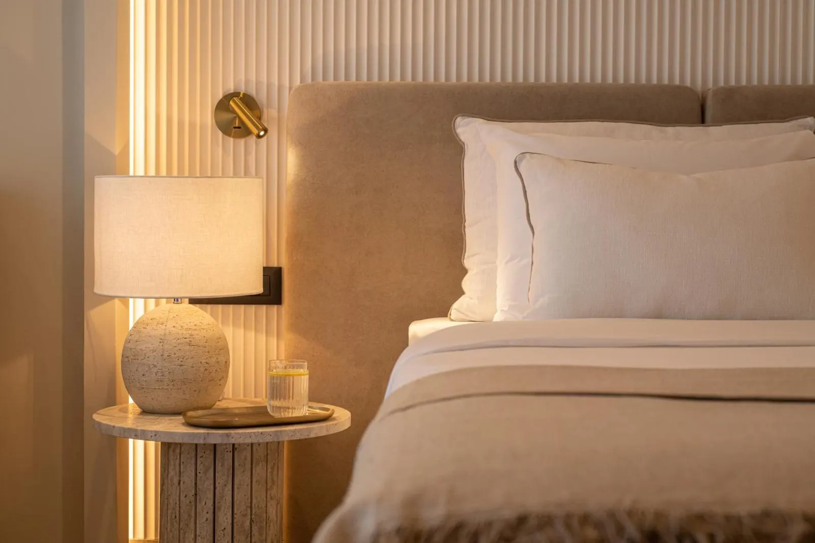 Cozy bedside table with lamp and soft lighting