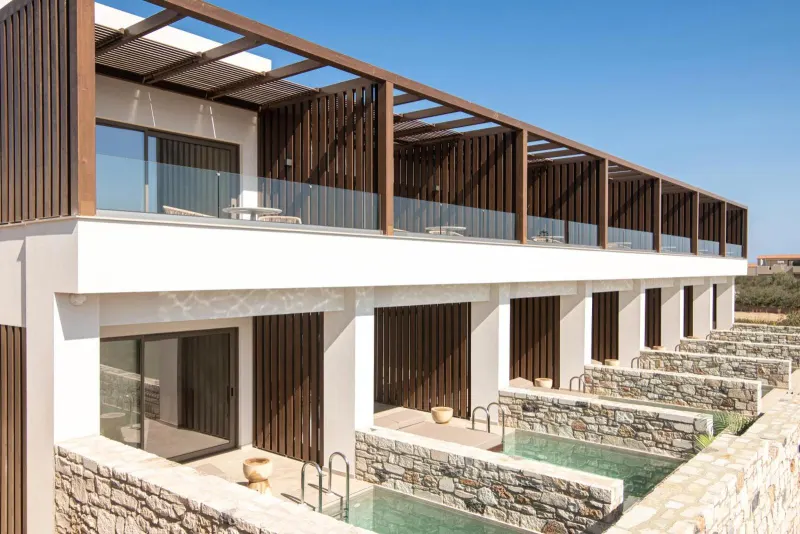 Exterior view of hotel suites with private pools