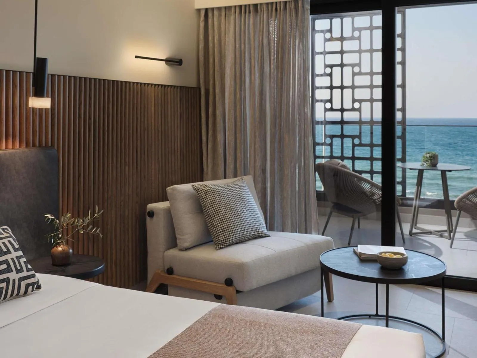Room seating area with ocean view balcony