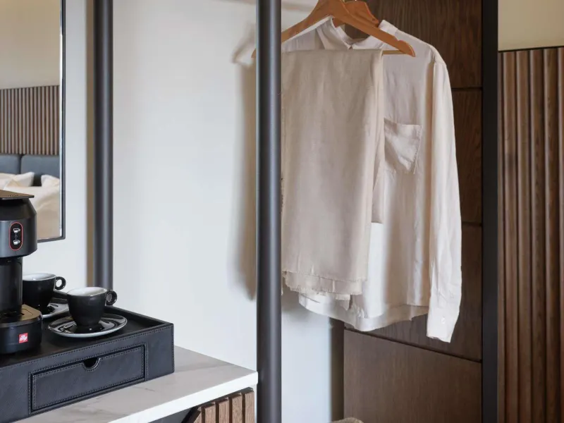 Closet area with hanging linen shirt