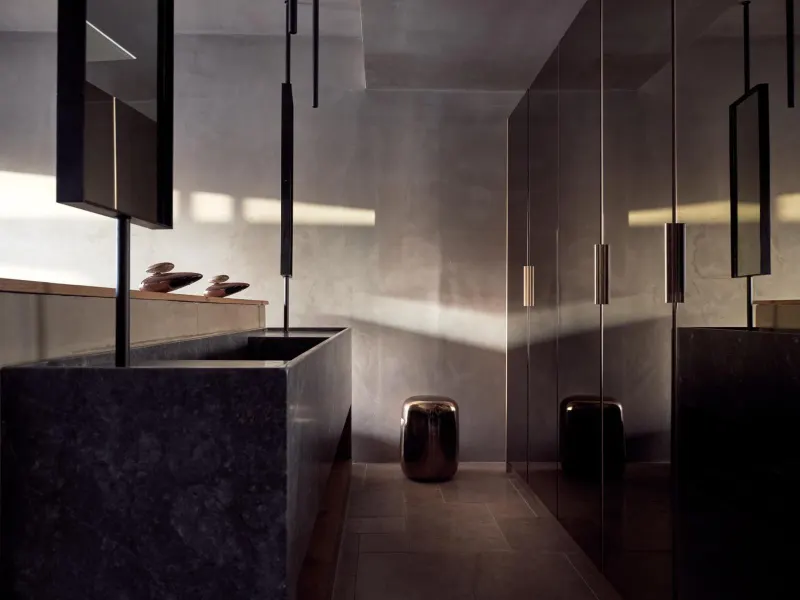 Modern dark stone bathroom with sleek fixtures