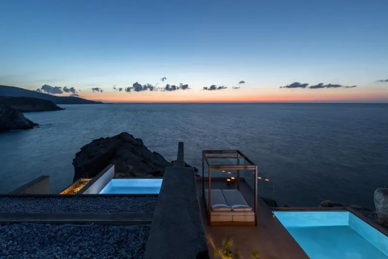 Twilight view of cliffside pools overlooking the ocean
