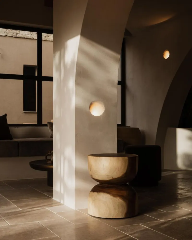 Sunlit lobby column with round side tables