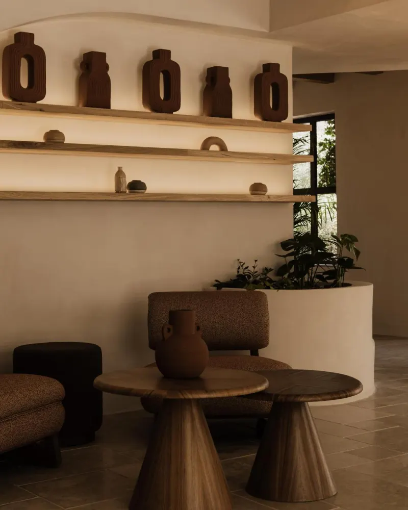 Lounge seating with terracotta vase and shelf display