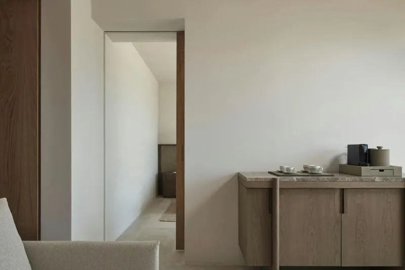 Hallway with wooden cabinet and neutral tones