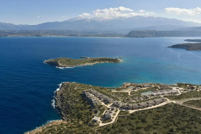 Aerial view of resort peninsula with mountains behind
