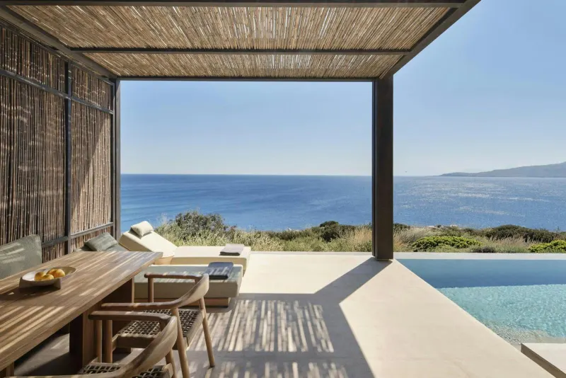 Private terrace with pool and sea view under pergola